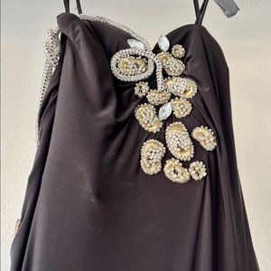 Spaghetti strap black bod con full length gown with intricate embellishments